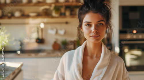 Kitchen Portrait: A Young Woman Radiating Delicate Beauty, Draped in a Bathrobe, Amidst Morning's Quiet Reverie