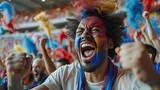 Ecstatic fan with colorful face paint in a cheering crowd.