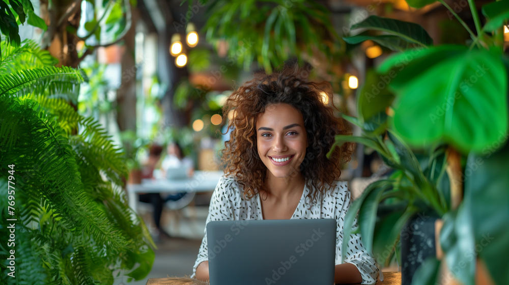 Multi-Ethnic businesswoman in a creative, green, and sustainable office space Multi-Ethnic businesswoman in a creative, green, and sustainable office space