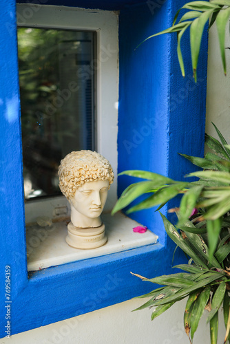 marble sculpted head in window © Andrei