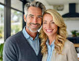 portrait of a 40-year-old couple man grey hair middle aged and woman blonde in their home 