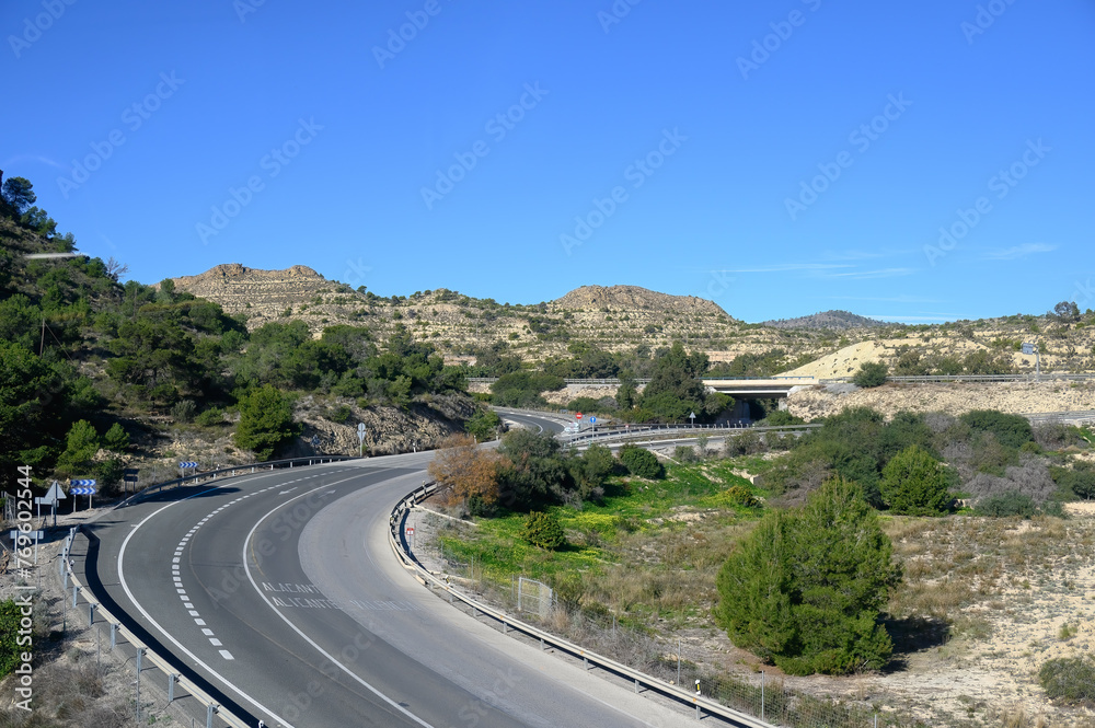 Rural road in semi-desert landscape, Alicante, Spain
