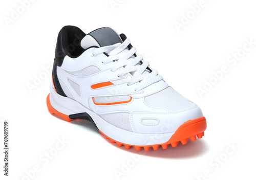 White, black and orange professional cricket shoes isolated on white background
