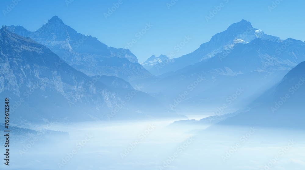 The mountains are covered in snow and the sky is a deep blue