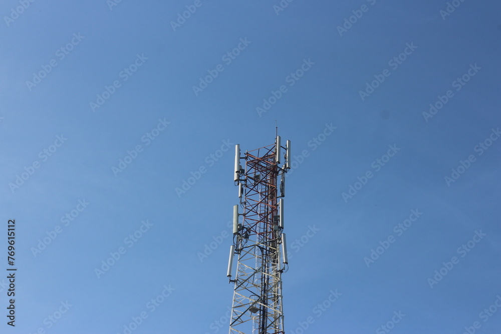 Signal tower or Mobile phone tower .Global connection and internet network concept.on blue sky. Signal tower or Mobile phone tower .Global connection and internet network concept.on blue sky.