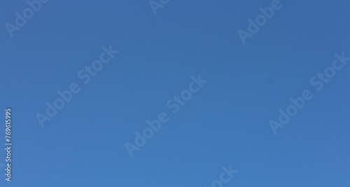blue sky only no cloud and sunshine. Soft focus blue sky background, copy space horizontal shape