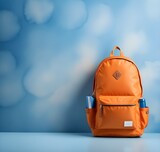 Orange backpack on a blue background