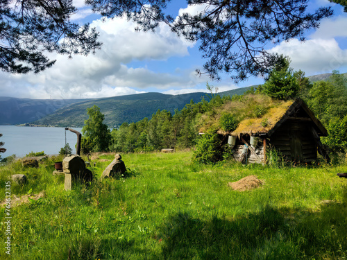 Εκτύπωση καμβά old, typical mountain hut, overgrown with moss by the lake in the mountains of N