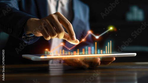 Hot business growth. Businessman using tablet analyzing sales data and economic growth graph chart. Business strategy, financial and banking. Digital marketing