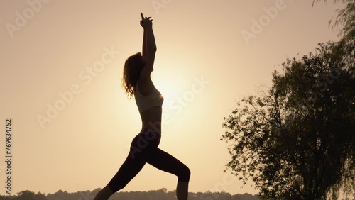 Development of body and soul: outdoor sports exercises during sunset. Rest and Focus: Meditation in a natural environment for inner peace and balance. photo