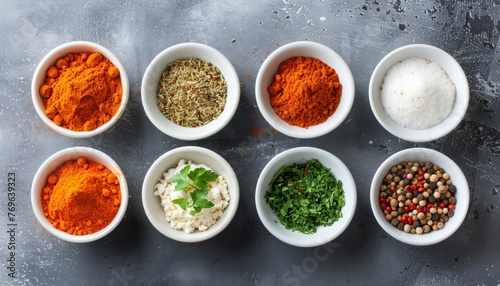 Fototapeta Naklejka Na Ścianę i Meble -  Colorful spice palette  artistic display of various spices in small bowls and containers