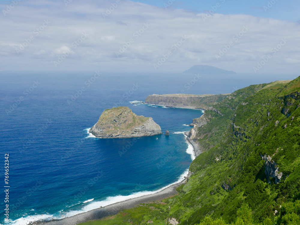 Hiking trail on Flores island connecting Faja Grande and Ponta Delgada, Azores, with view over to islet of Maria Vaz and island of Corvo