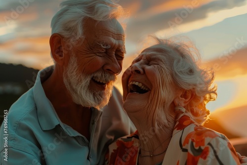 Closeup of a joyful elderly couple laughing together at sunset, epitomizing senior health and happiness