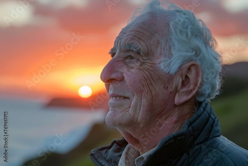 Elderly man gazing at the sunset, closeup on his peaceful smile, reflecting a life well-lived and healthy aging