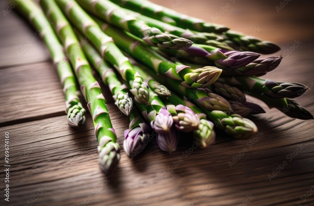 Bunch of fresh green asparagus spears on rustic wooden table. - obrazy, fototapety, plakaty 