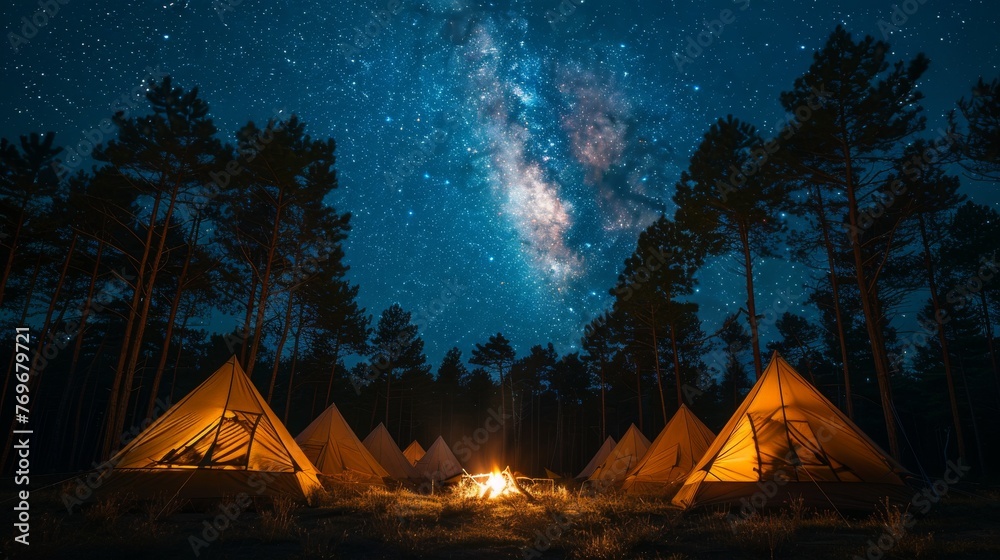Camping under the Stars: A cozy campsite under a starry night sky, with a crackling campfire and silhouetted tents, conveying the joy of outdoor camping.