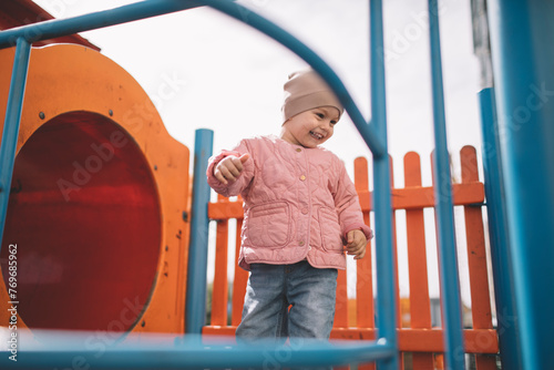 Little girl playing on the playground