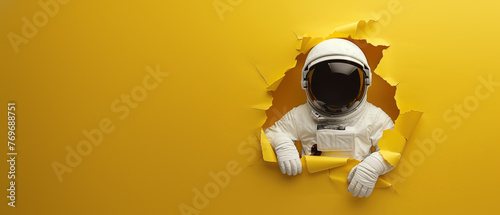 An astronaut in a white spacesuit breaks through a vibrant yellow wall, creating a dynamic and impactful visual