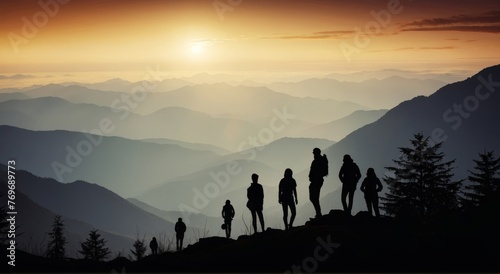 Climbers Sillhouettes against on mountains photo