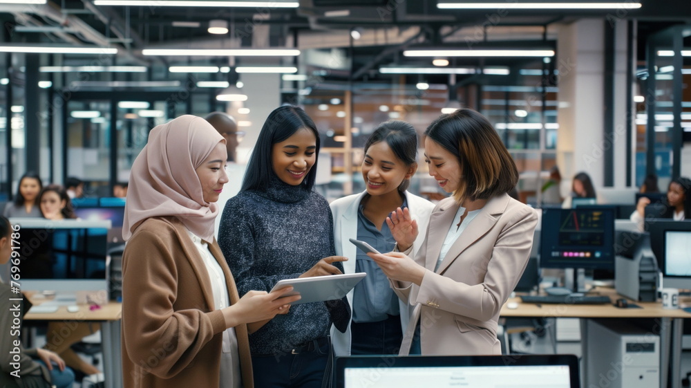 Diverse group of women sharing ideas over a digital tablet in a contemporary office setting. Diverse group of women sharing ideas over a digital tablet in a contemporary office setting.