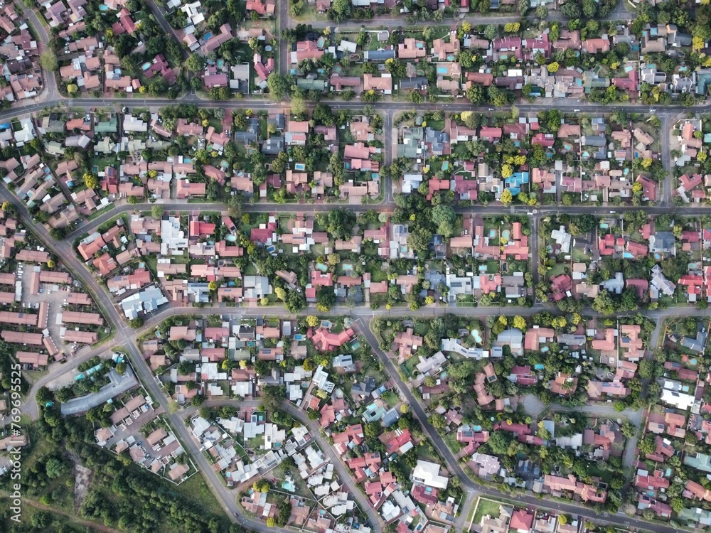 Birds-eye view of a residential neighborhood, featuring houses and roads