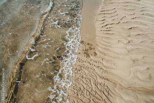 Tidal Beauty: Sculpted Sand Patterns at Low Tide photo