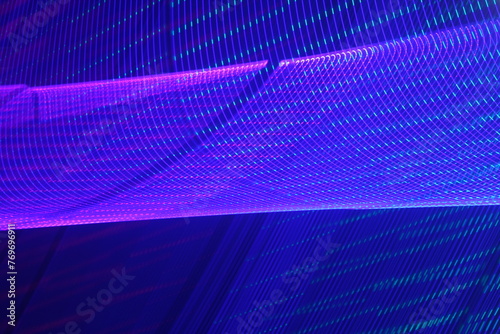Large display featuring a pattern of blue and pink lights radiating outward along distinct lines