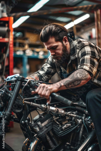 A male mechanic working on an American motorcycle