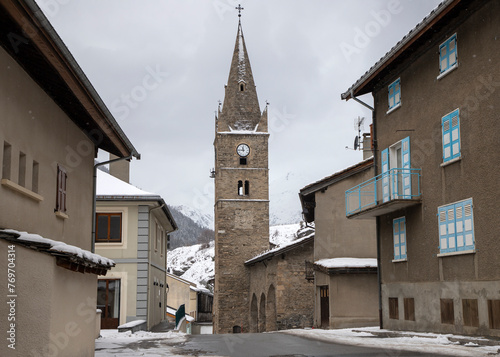 A bell and clock tower in Lanslebourg, a small, picturesque town in the French Alps photo