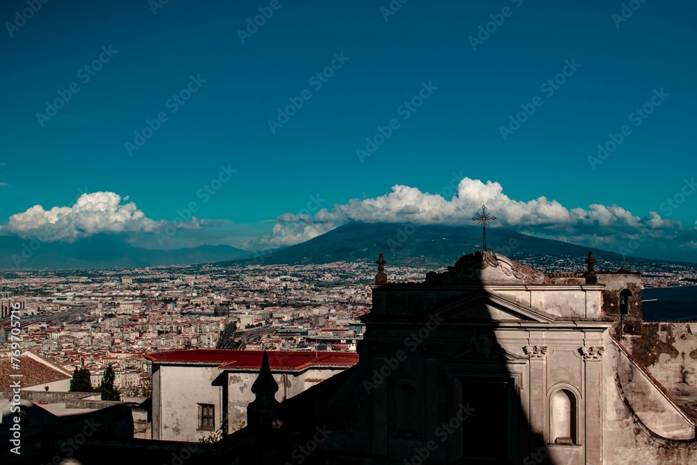 Napoli city landscape during summer. Architectural view with Vesuvius volcano in the background