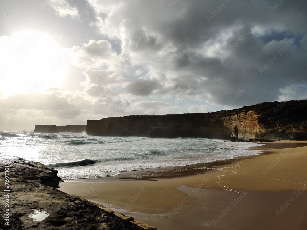 Scenic beach with waves and cliffs backdrop. Twelve Apostles, Melbourne