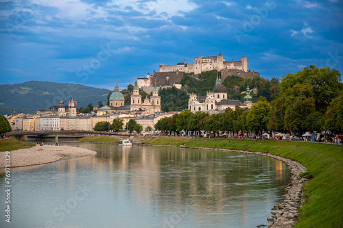 Salzburg, Austria, August 15, 2022. Golden hour shot towards the historic center. Highlighted is the fort at the top of the hill which dominates the landscape.