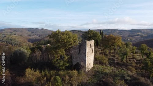 Drone pullout of a Medieval tower from the year 1200 on mountain in Barberino Val d'Elsa, Italy photo