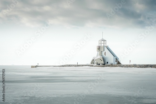 Nallikari Lighthouse surrounded by the sea in Oulu, Finland photo