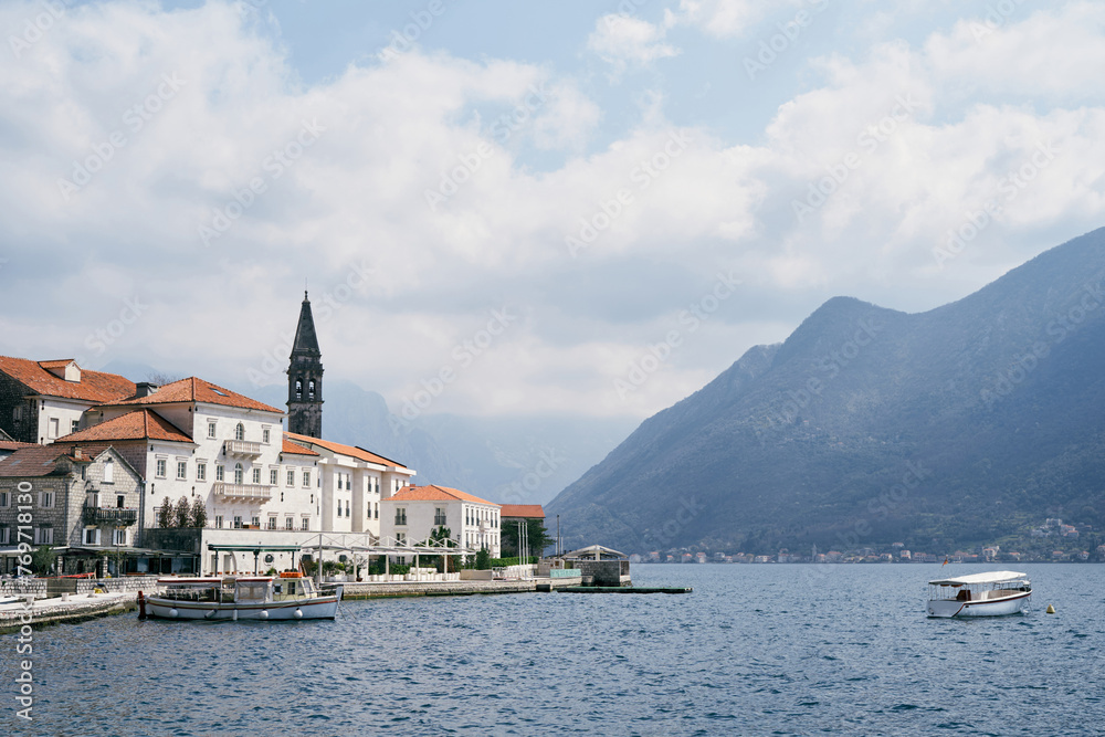 Motor boats are moored off the coast of Perast. Montenegro