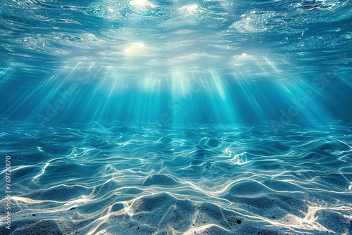 light blue ocean seen from underwater, clear ocean scene with light from the sun shining from above © Martin