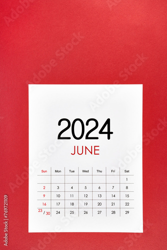 June 2024 calendar page with push pin on red.