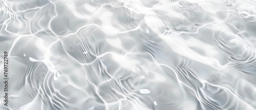Abstract white clear water texture background with ripples and waves, top view. Minimalist and clean background.