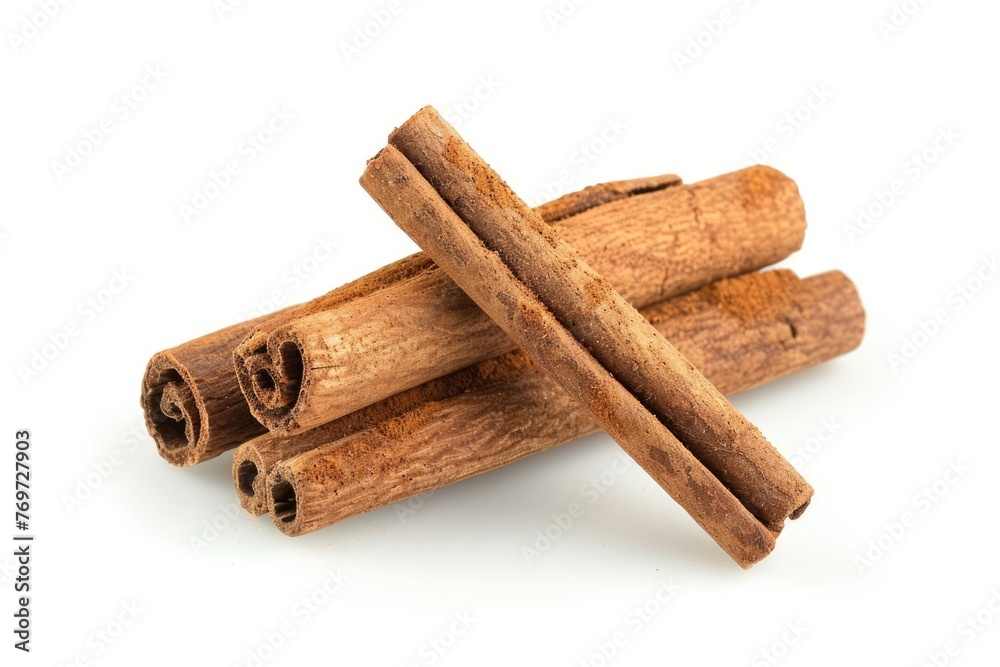Isolated Cinnamon on White Background. Closeup of Cinnamon Stick - a Key Ingredient for Food, Dessert and Decoration Isolated Cinnamon on White Background. Closeup of Cinnamon Stick - a Key Ingredient for Food, Dessert and Decoration