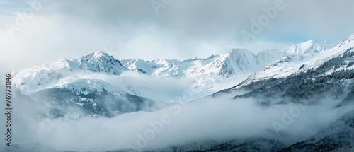 panorama view of cold snowy mountains ranges peaks at altitude landscape covered with clouds at daytime © DailyLifeImages