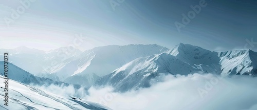 panorama view of cold snowy mountains ranges peaks at altitude landscape covered with clouds at daytime © DailyLifeImages