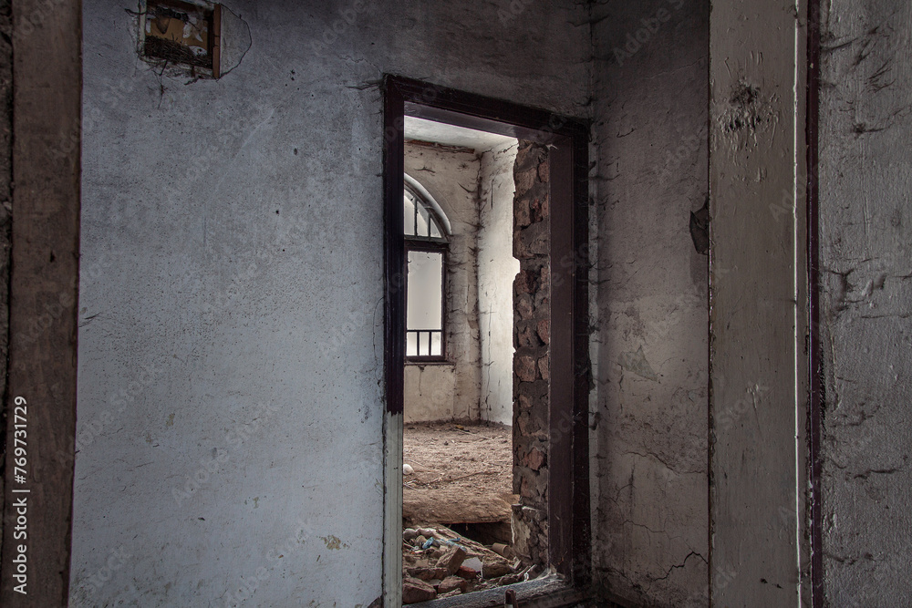 Capture the poignant aftermath of the war with this photo showcasing destroyed old houses in a village. Perfect for illustrating themes of rebuilding, recovery, and the enduring spirit of communities