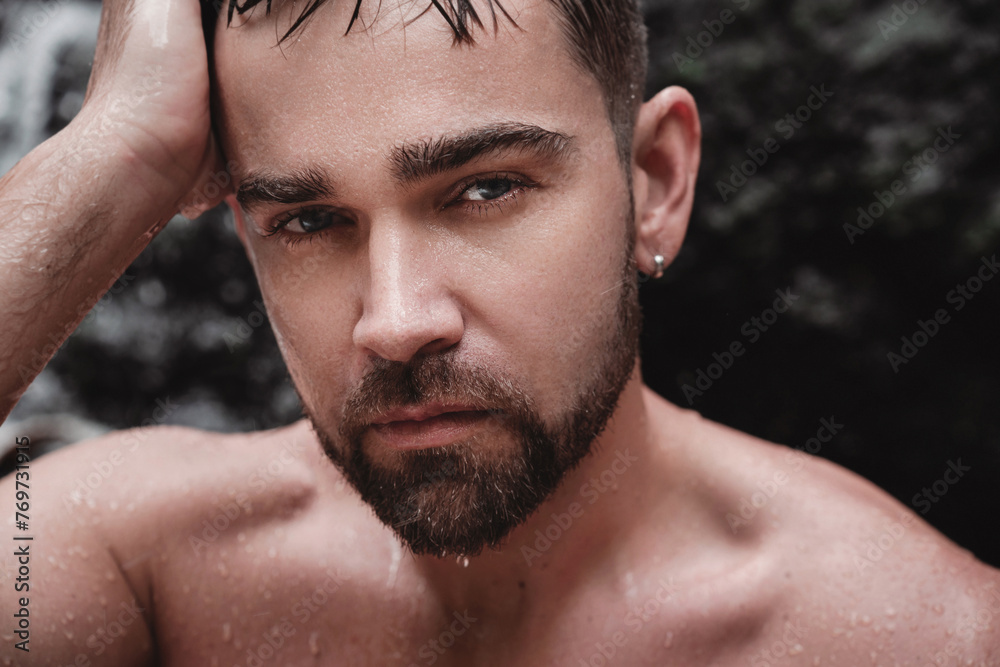 Closeup portrait of handsome bearded man with wet skin and hair Closeup portrait of handsome bearded man with wet skin and hair