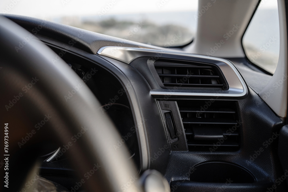 Closeup view of air vent inside modern car dashboard