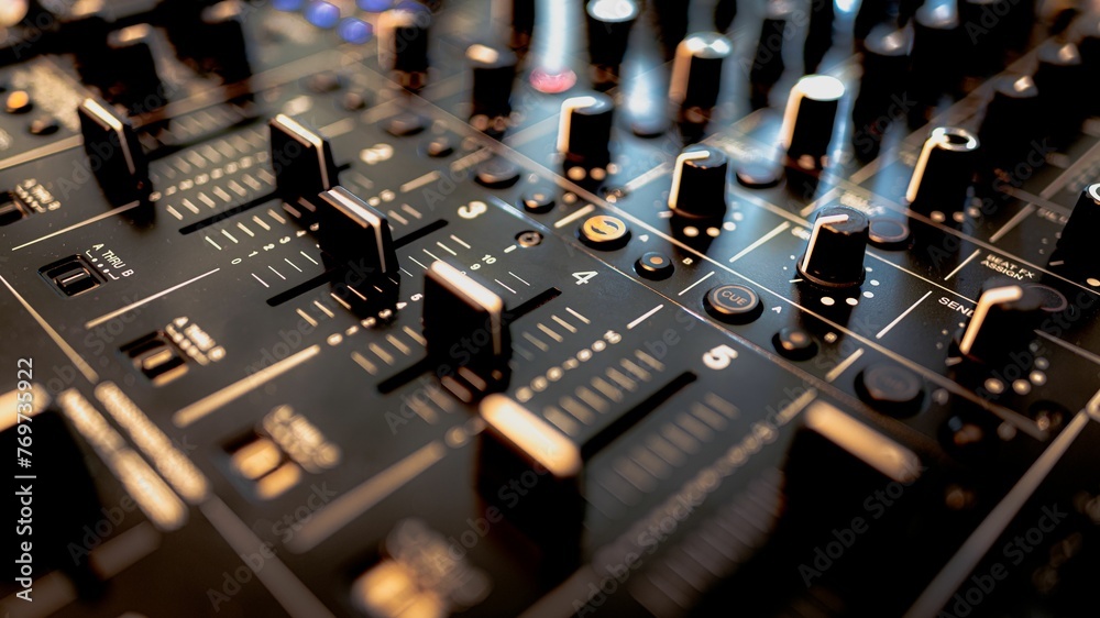 Detailed closeup of the knobs and buttons on a professional audio mixing console Detailed closeup of the knobs and buttons on a professional audio mixing console