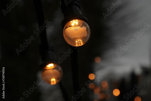 Close-up shot of dimly lit lights in a solemn atmosphere