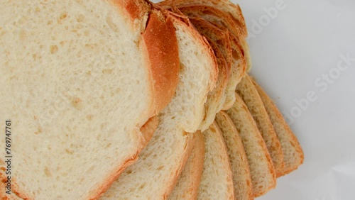 Close-up of fresh and appetizing sliced bread, perfect for a delicious breakfast. Fresh, fluffy, and irresistible sliced bread in a close-up that whets the appetite. photo