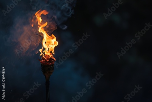 A burning torch in darkness, representing the light of innovation and the path to progress © Shutter2U