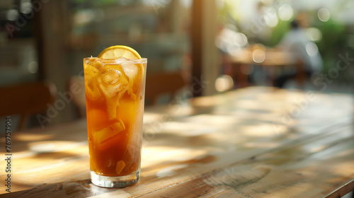 ice tea with slice of lemon on the wooden