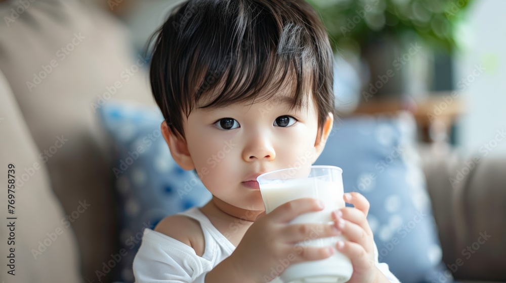World Milk Day, Asian child, 4 years old, 5w, holding milk World Milk Day, Asian child, 4 years old, 5w, holding milk